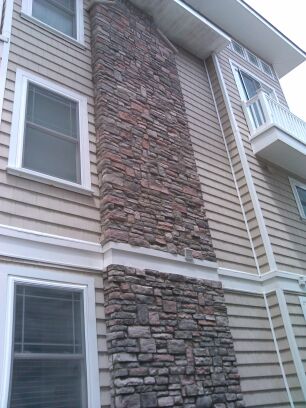 The exterior of a chimney on a residential building.