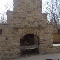 An outdoor fireplace and chimney.