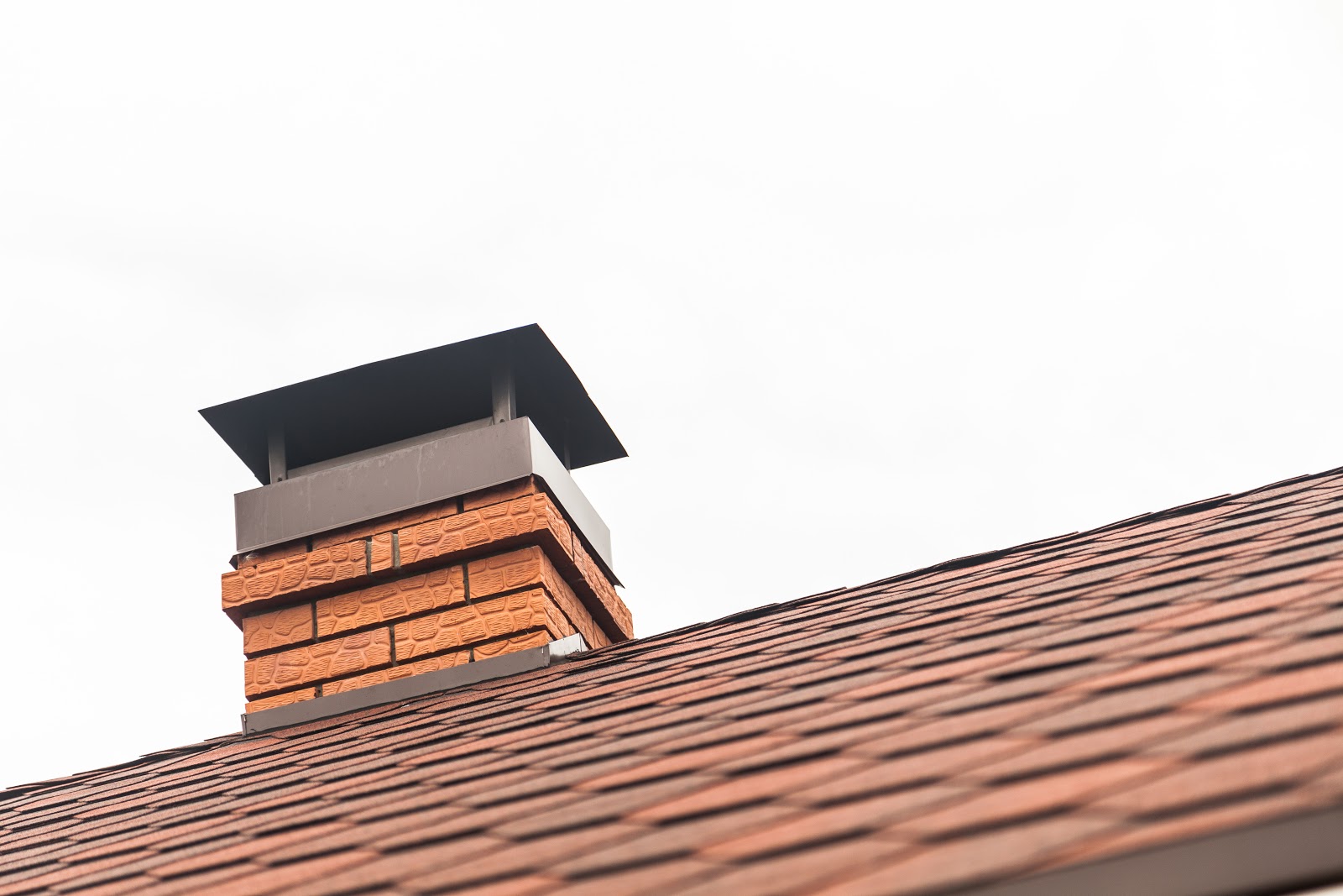 image of residential home exterior roof and chimney