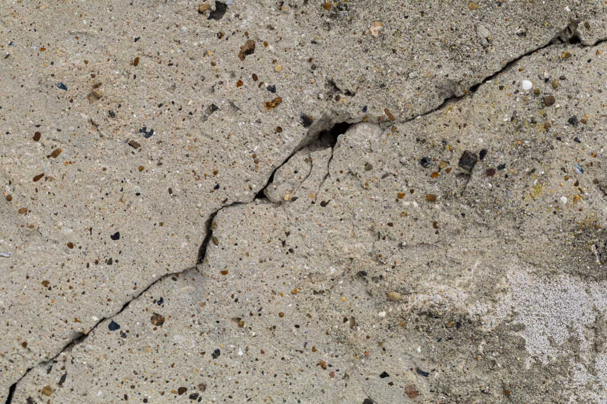A large crack in cement.
